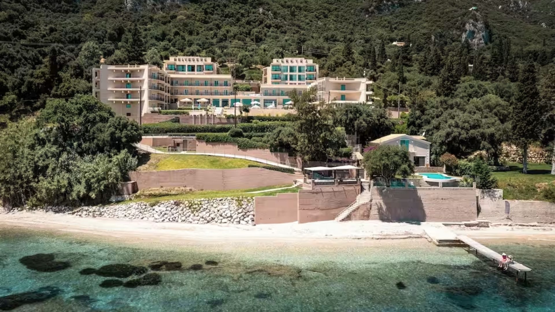 Beachfront villa on the island of Kos, featuring stunning ocean views and direct access to the sandy shore.