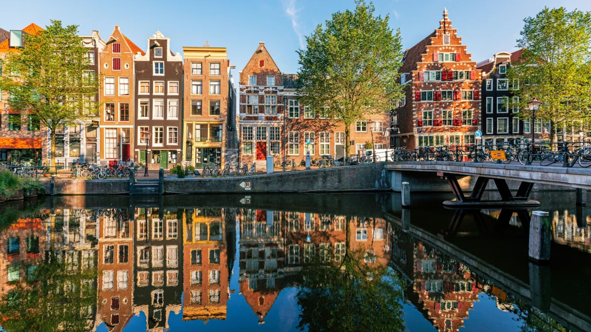 A scenic view of Amsterdam, showcasing its iconic canals and historic architecture in the heart of Europe.