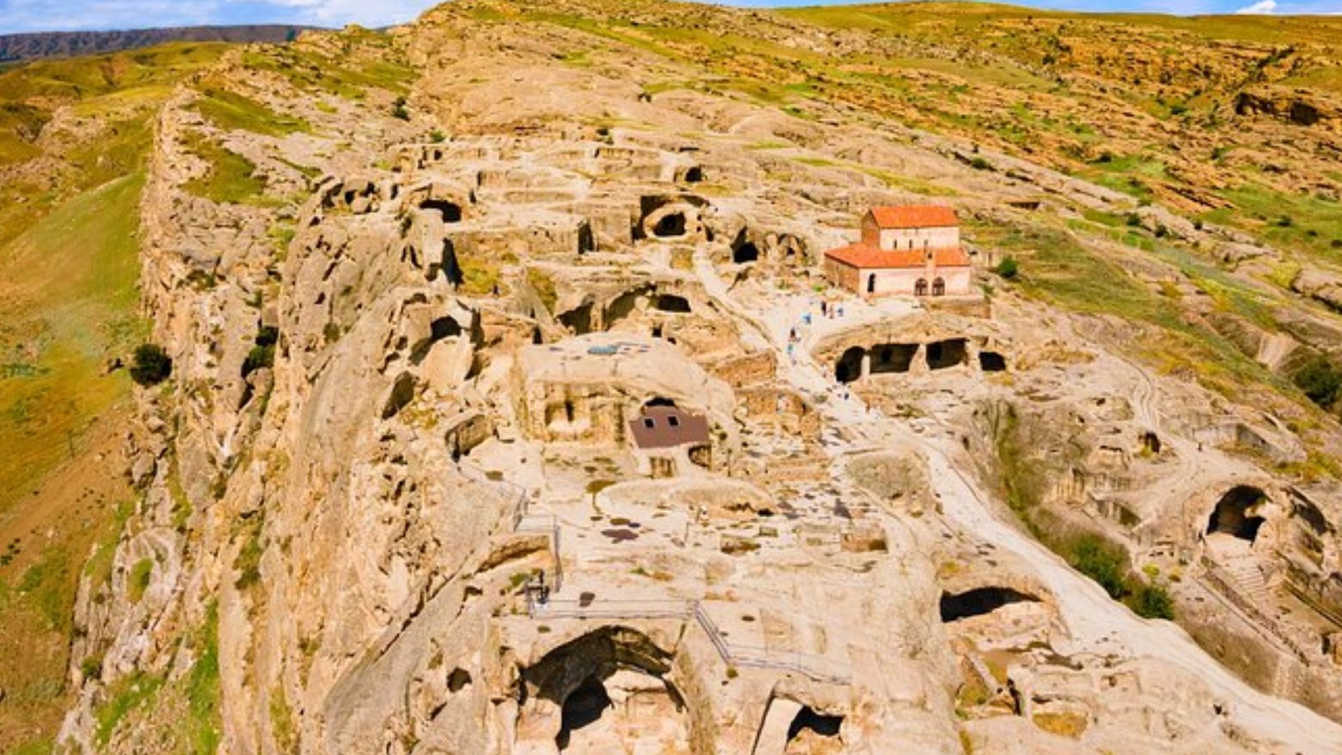 A panoramic view of the ancient city of Cappadocia, Turkey, showcasing its unique rock formations and historical architecture.