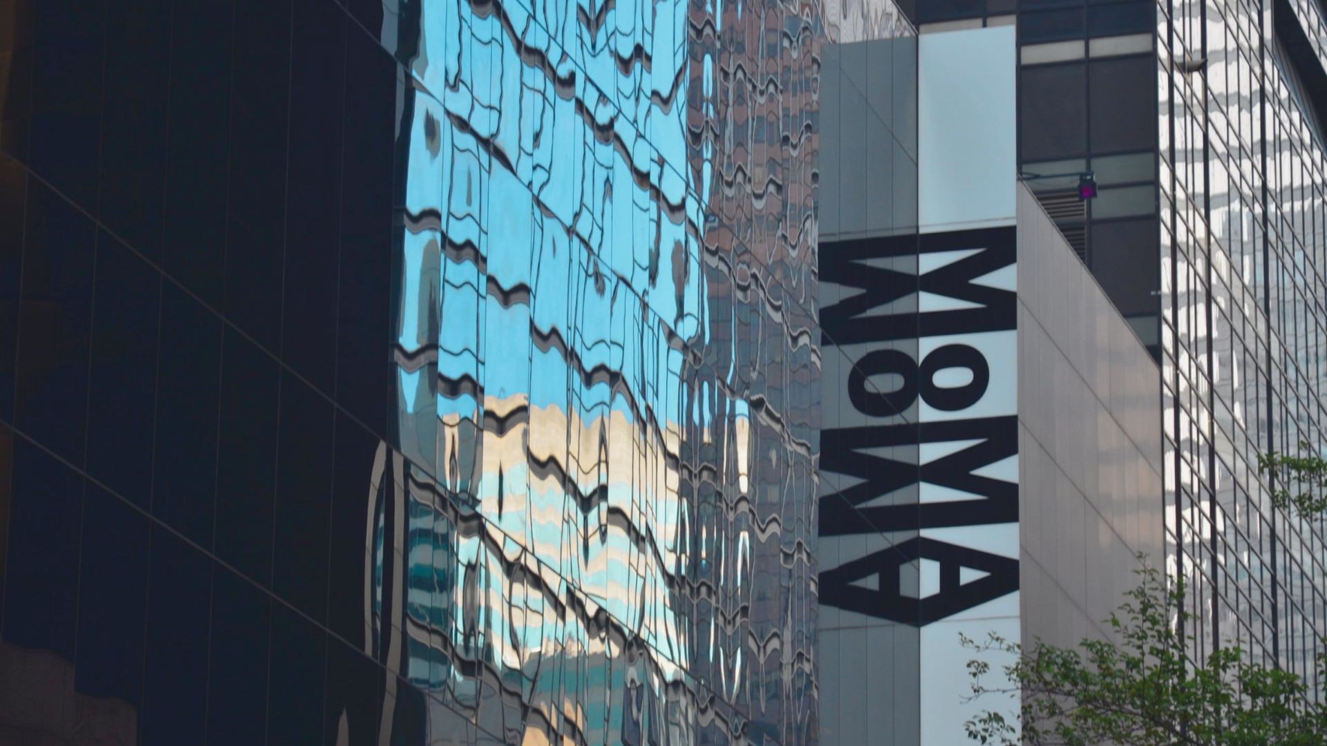 A building featuring a prominent sign displaying the letters "m8m" on its facade.