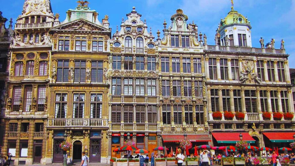 What Is Brussels Known For? Top Facts & Hidden Gems The Grand Place in Brussels, showcasing ornate architecture and vibrant flowers in a bustling public square.