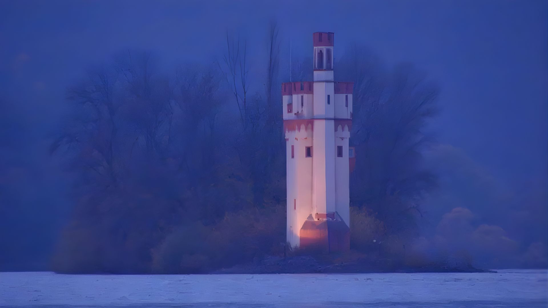 A tall lighthouse with illuminated windows stands on a small, tree-covered island. The scene is enveloped in a misty blue twilight, creating a serene and mysterious atmosphere.