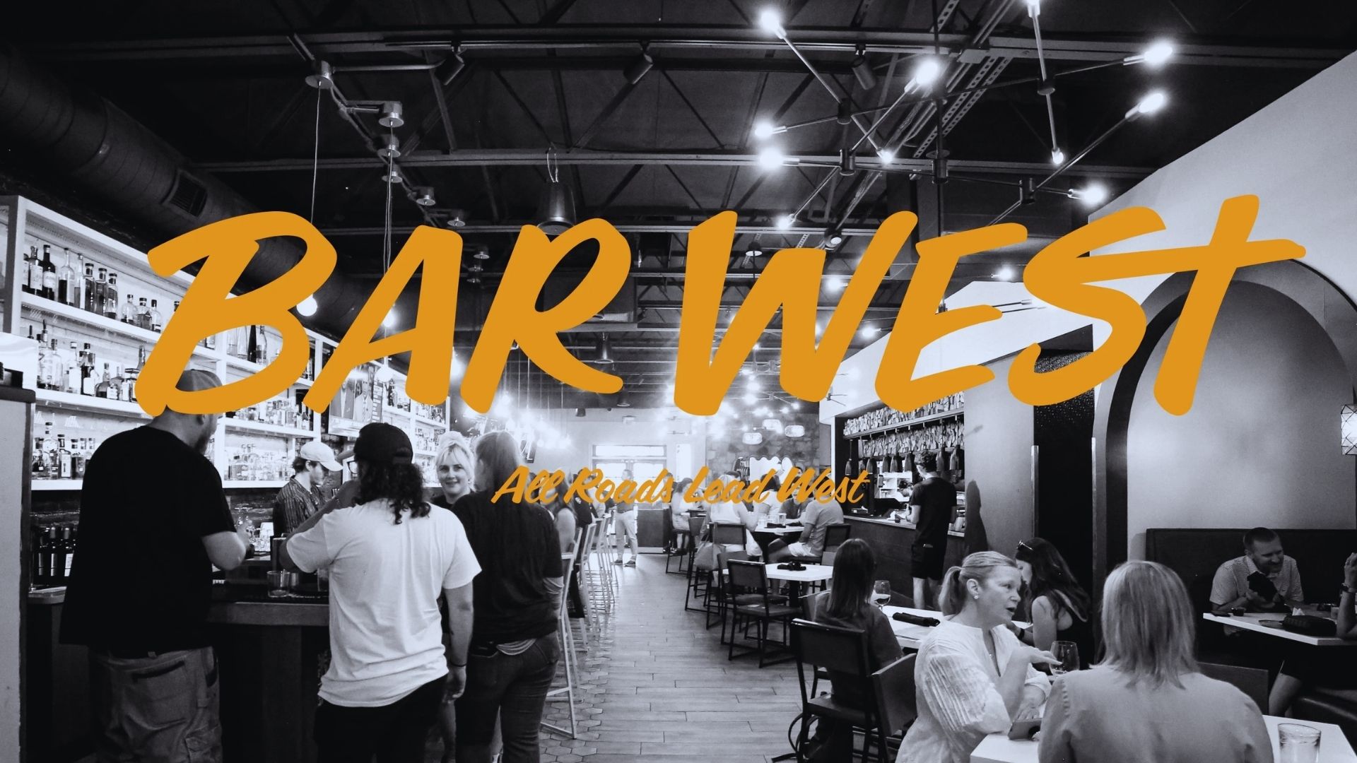 A lively bar scene in West Atlanta, featuring patrons enjoying drinks and socializing in a vibrant atmosphere.