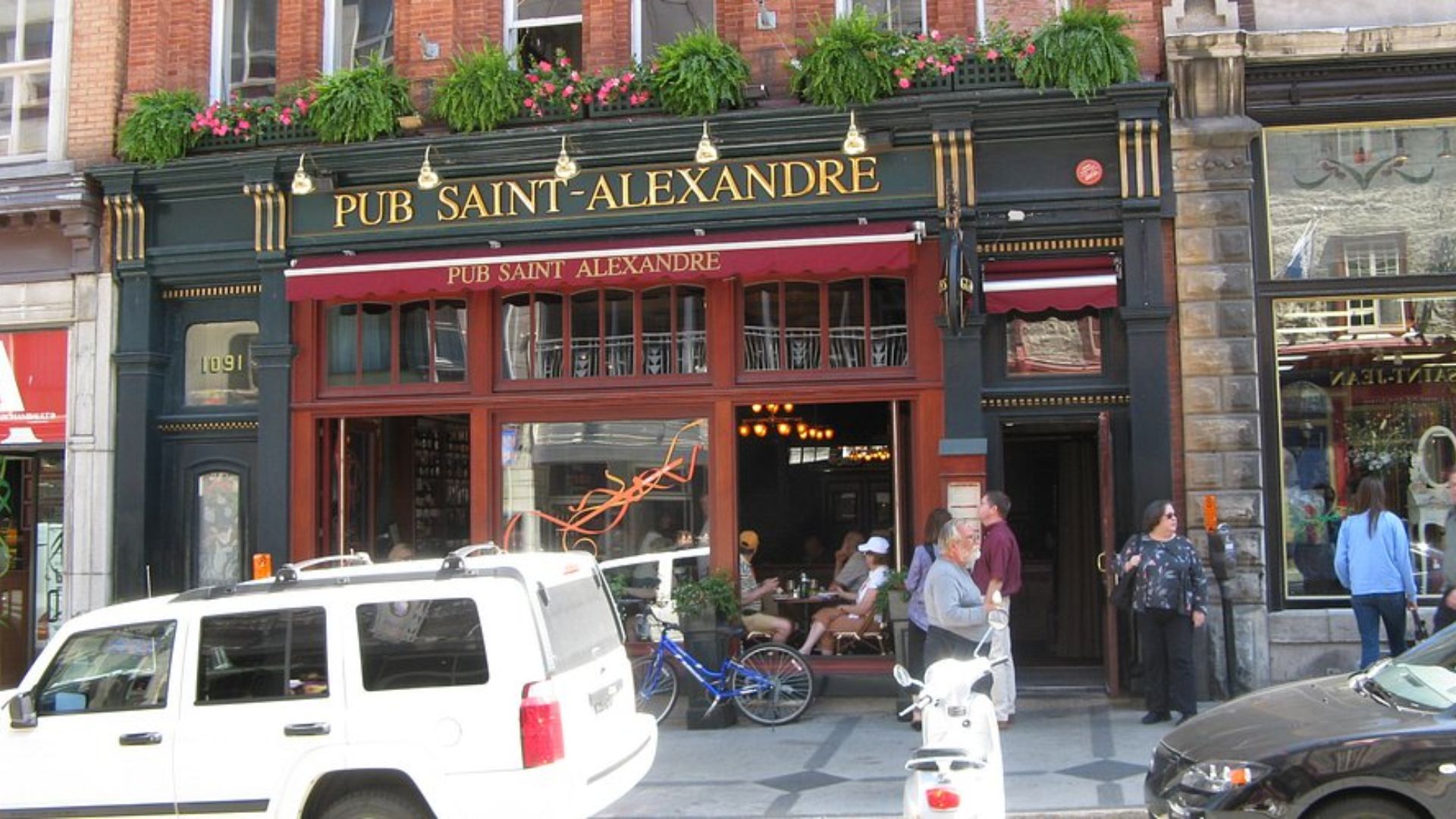 A building exterior featuring a prominent sign displaying its name or purpose.