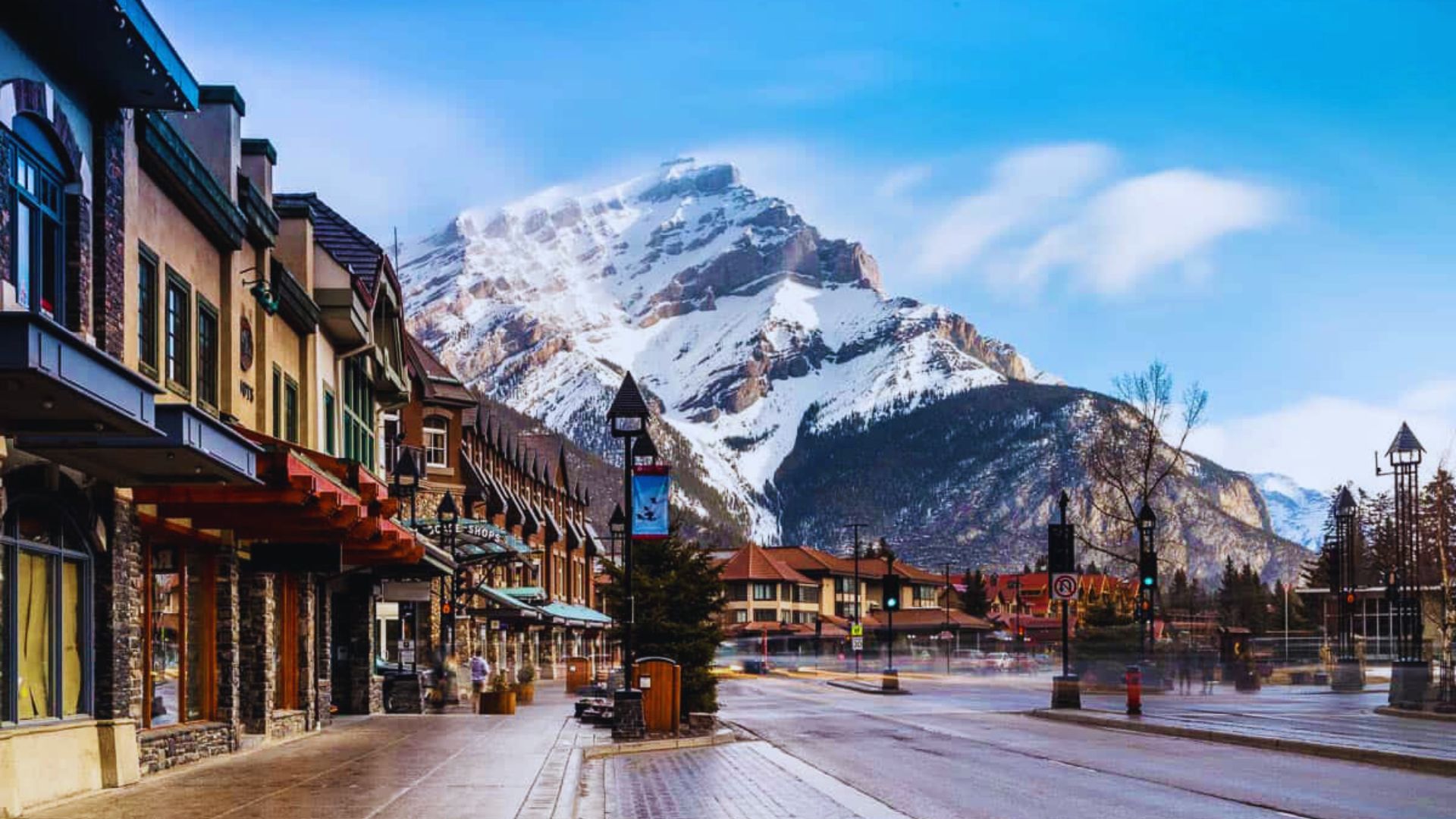 The town of Banff is visible in the background, surrounded by mountains and lush greenery.