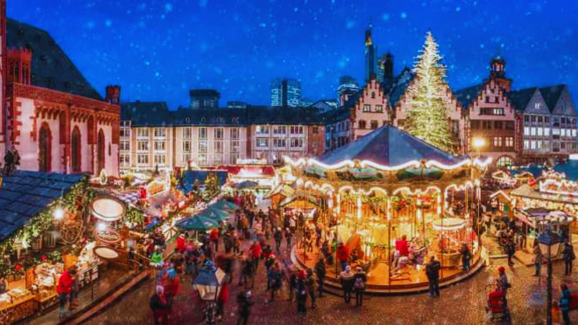A bustling Christmas market in Germany, featuring people shopping and cars parked nearby amidst festive decorations.