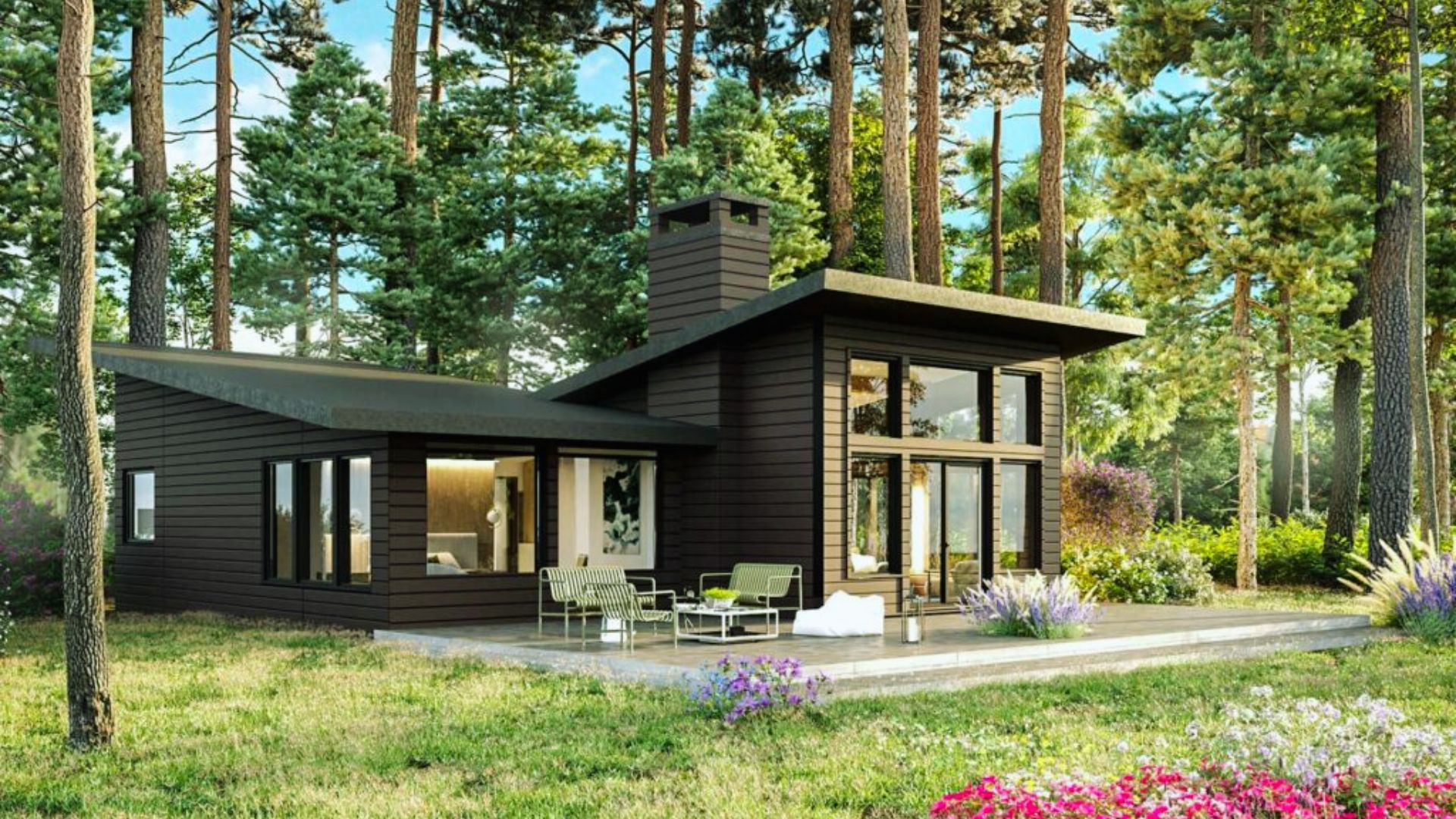 Modern cabin in a lush forest setting, featuring large windows and dark wood exterior. Bright green grass and colorful flowers add to the serene atmosphere.