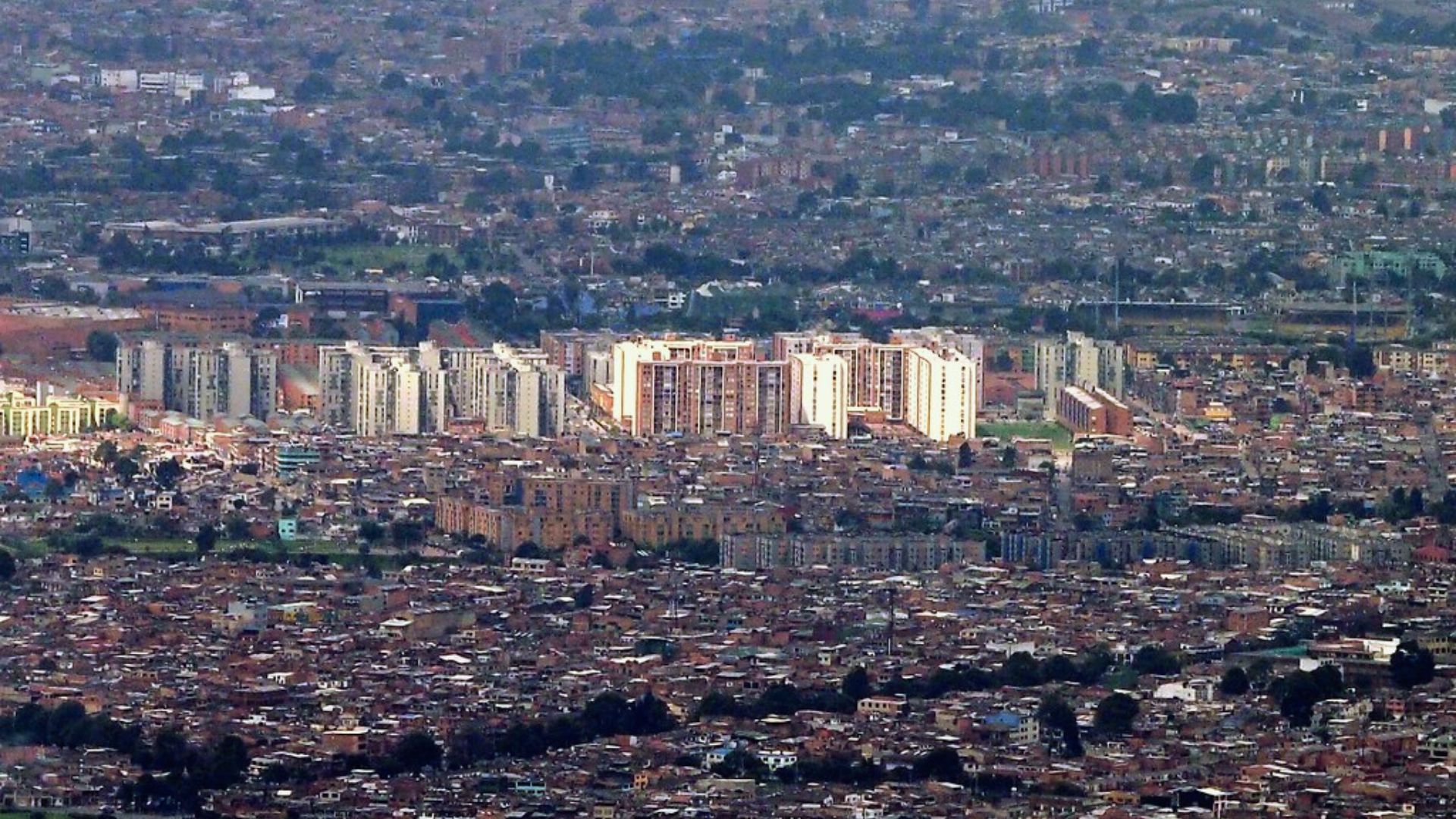 A bustling city skyline filled with numerous tall buildings and a vibrant urban atmosphere.