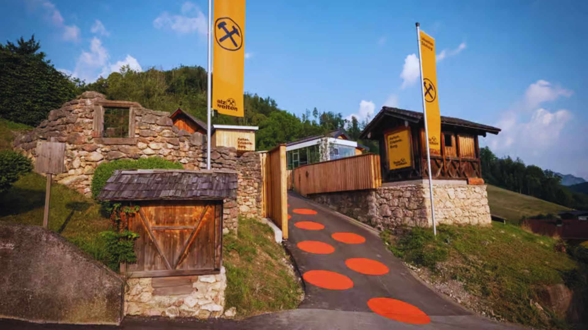 A yellow flag lies on the ground in front of a building, indicating a specific area or event.