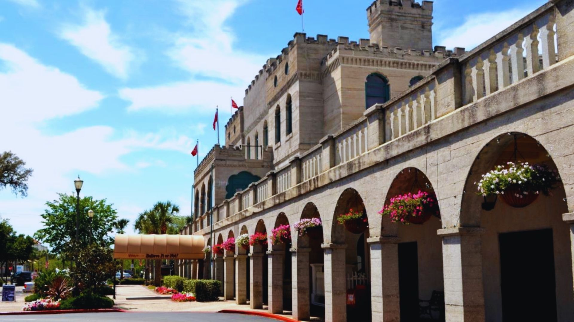 Front view of a large stone building showcasing its architectural details and entrance.