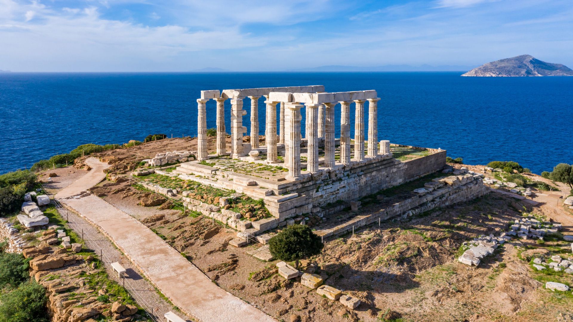 The Temple of Poseidon stands majestically in the ancient city of Acropolis, Greece, showcasing classical architecture.