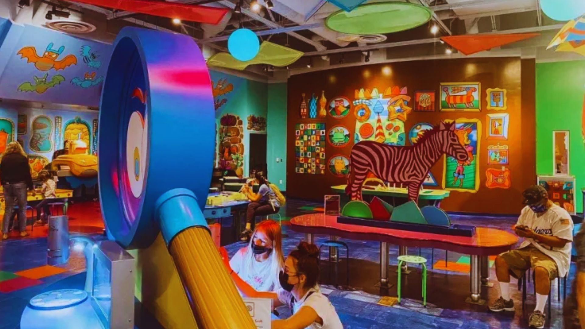 A vibrant children's play area featuring colorful walls and an array of playful toys for imaginative fun.