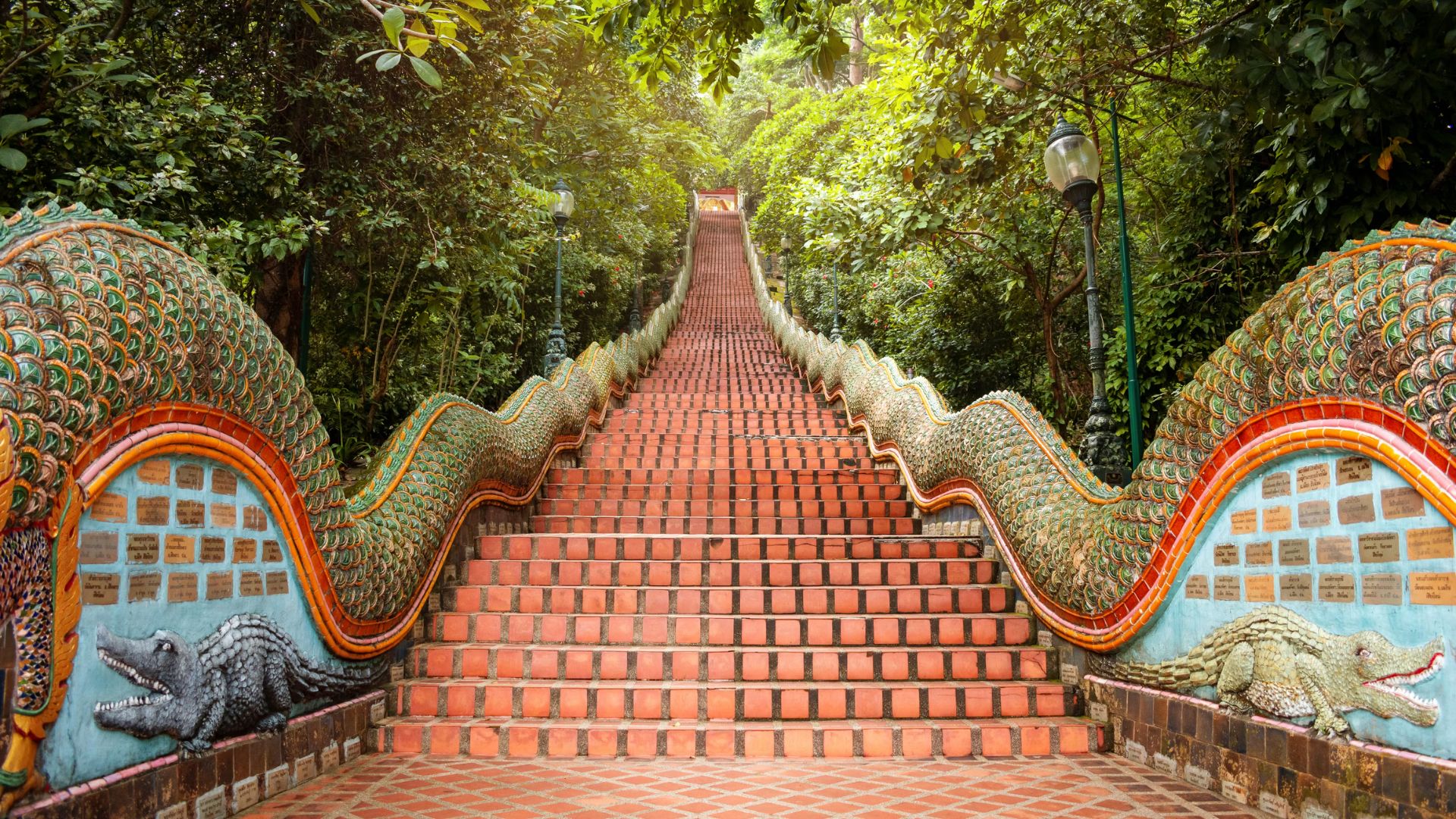 Colorful tiles adorn the stairs leading to the mountain's summit, creating a vibrant pathway for hikers.