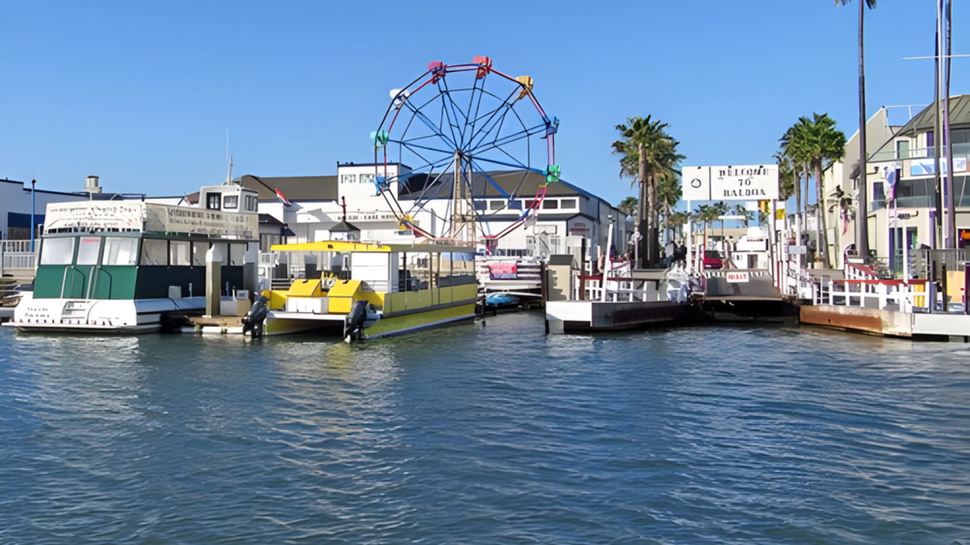 A ferris wheel towers over a pier filled with docked boats, capturing the essence of a lively waterfront atmosphere.