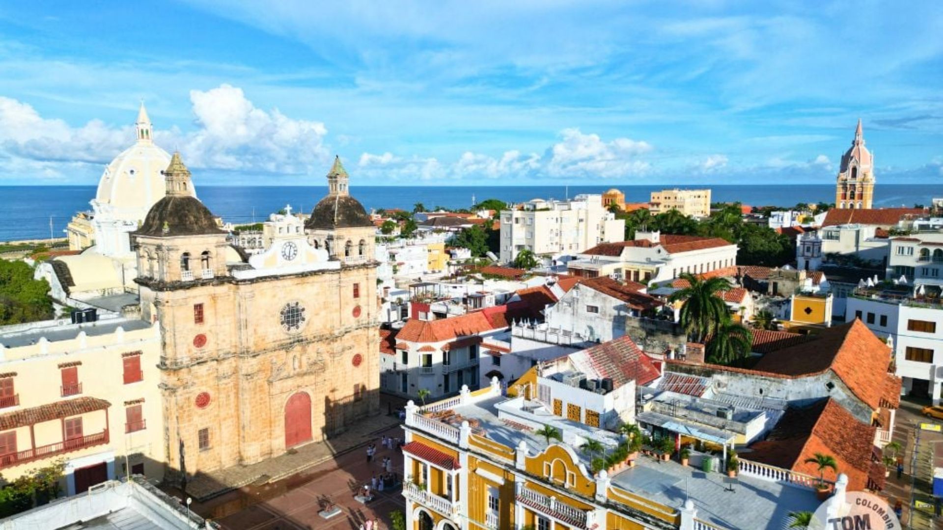 A panoramic view of Cartagena, Colombia, showcasing its colorful colonial buildings and vibrant coastal scenery.