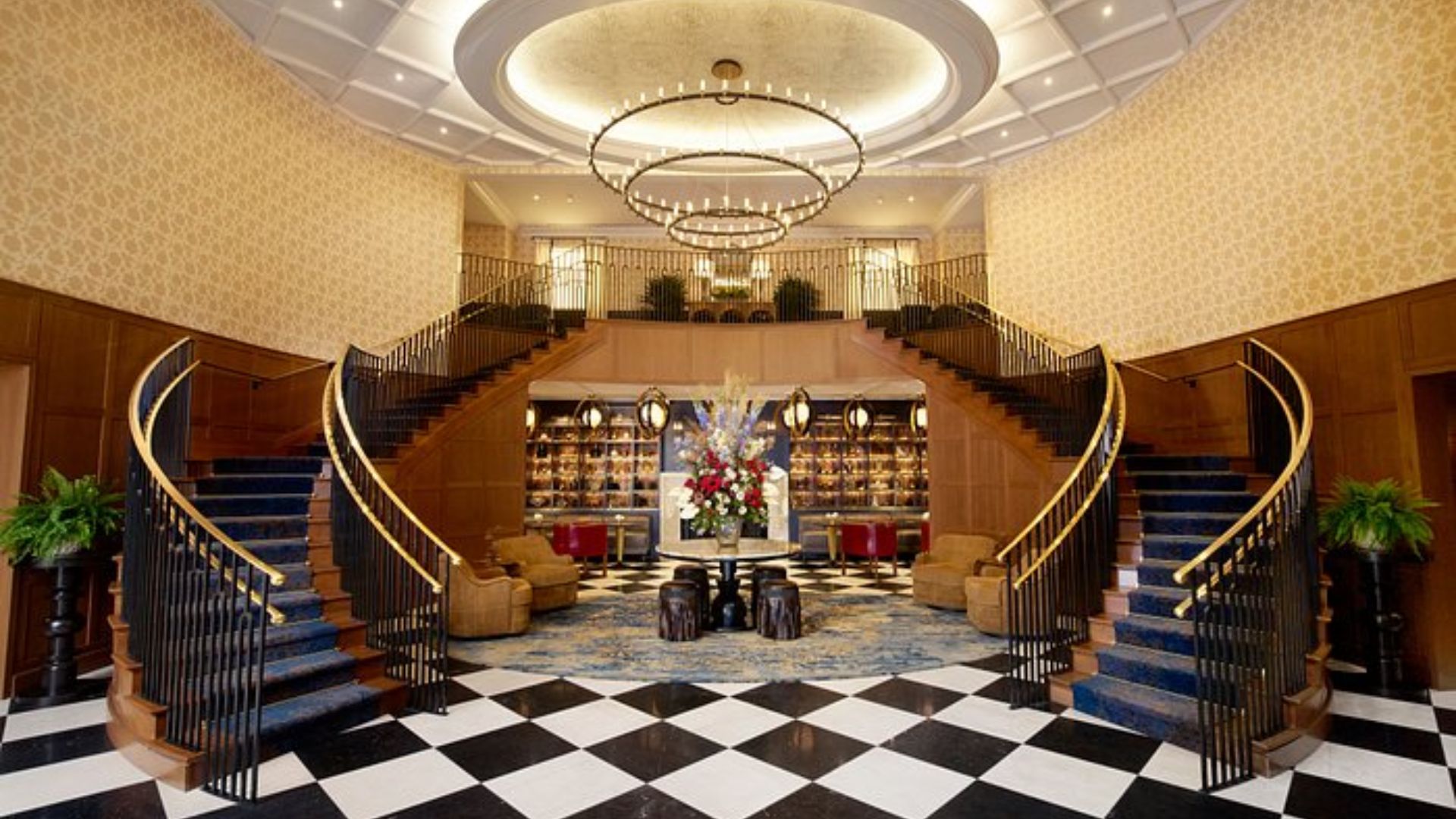 The hotel lobby features elegant black and white checkered floors, creating a stylish and inviting atmosphere.