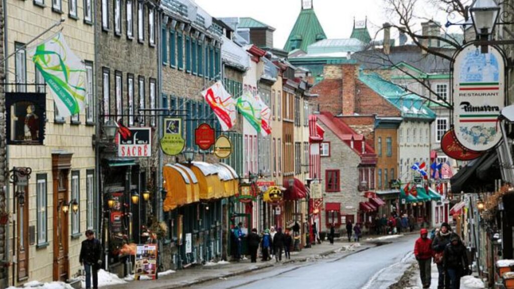 A charming street in the old town of Quebec City, featuring historic buildings and cobblestone pathways.