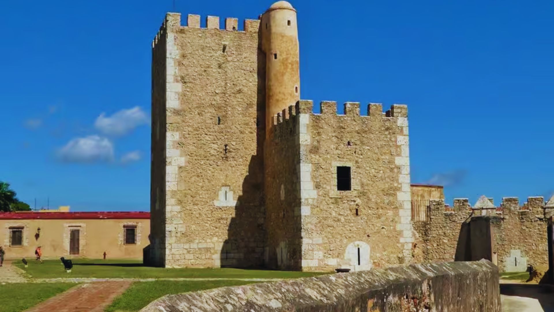2. A sturdy stone castle with a tall tower, showcasing medieval architecture.