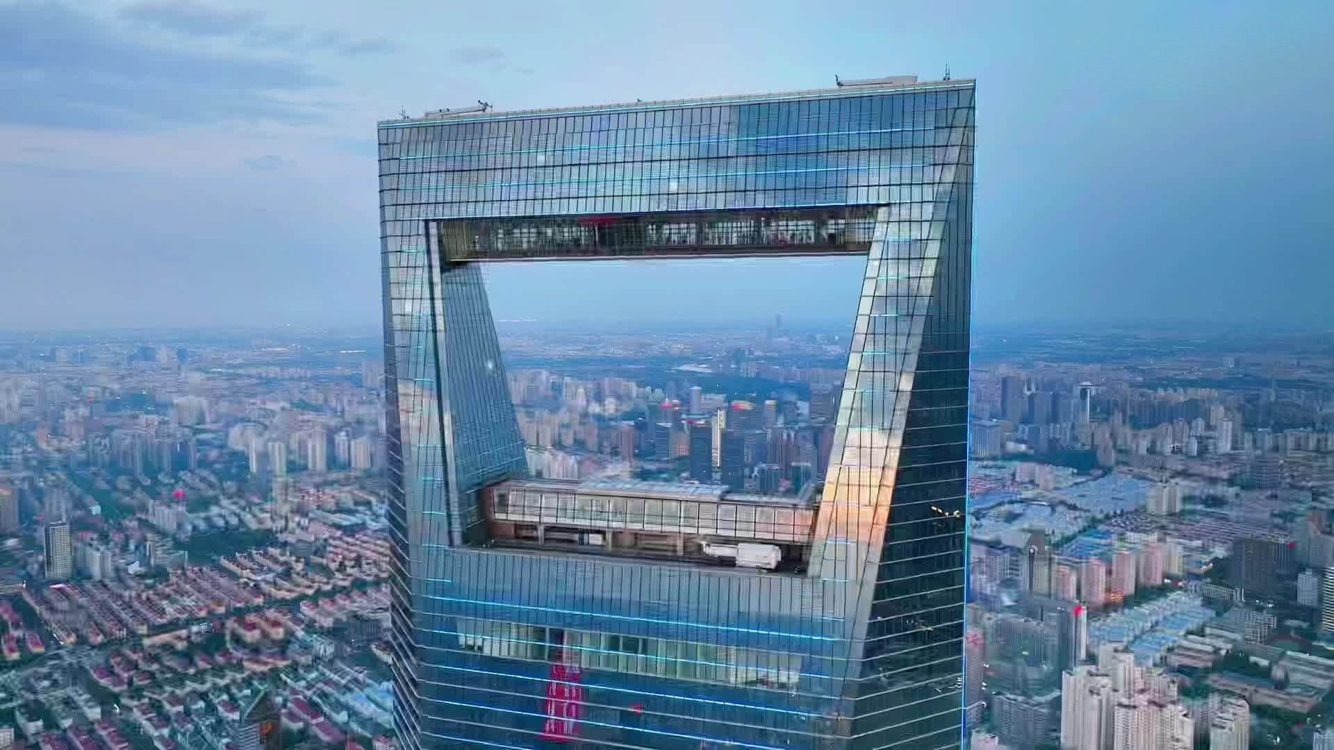 The Shanghai Tower, the world's tallest building, rises majestically against a clear blue sky.