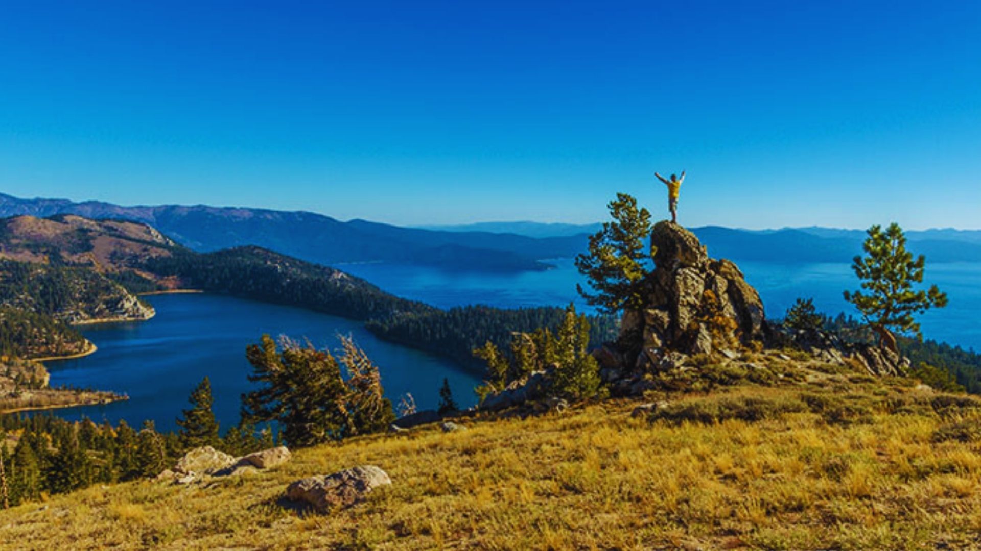 Scenic view of Lake Tahoe, California, known as the "Lake of the Gods," surrounded by mountains and lush forests