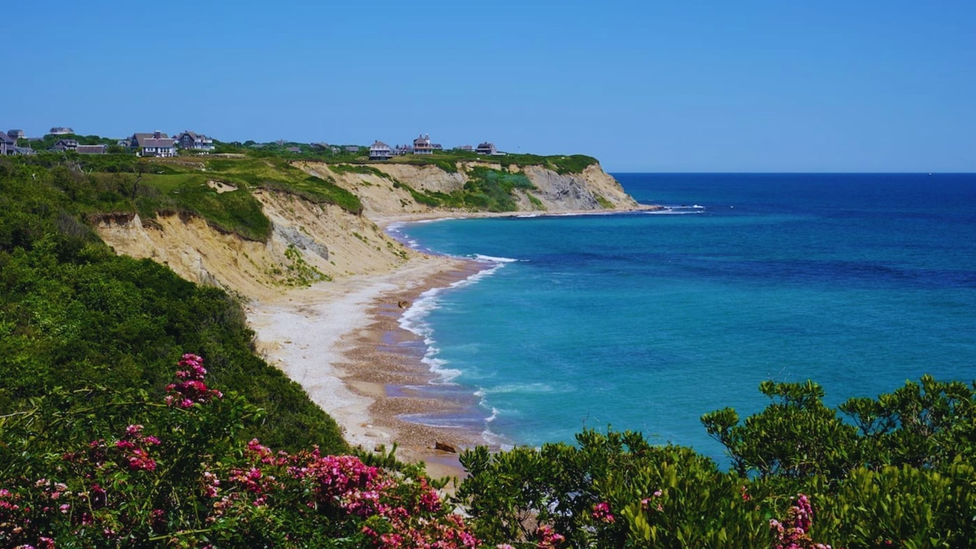 Photograph of Cape Cod beach wall art by Jimmy Kirk, showcasing serene sand and ocean scenery under a clear blue sky.