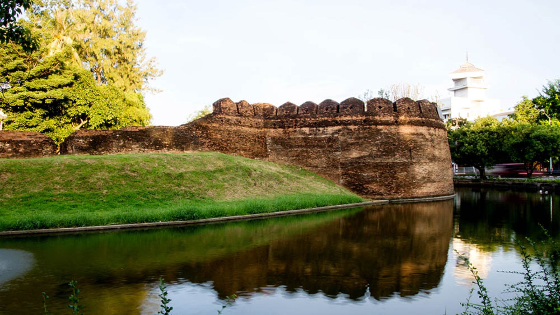 The ancient city wall of Kandy, Sri Lanka, showcasing its historical architecture and lush surroundings.