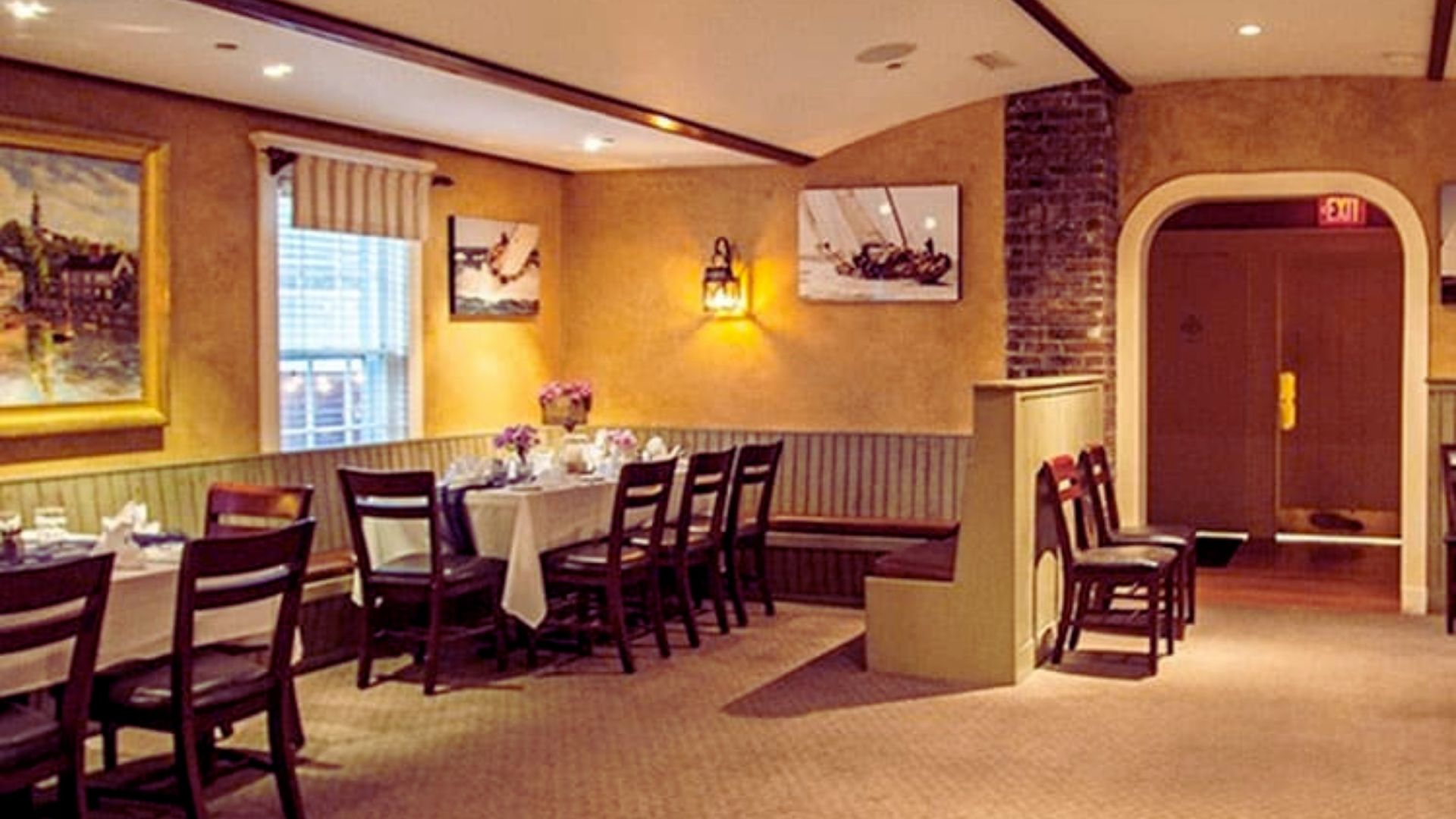 A restaurant dining room featuring neatly arranged tables and chairs for guests.