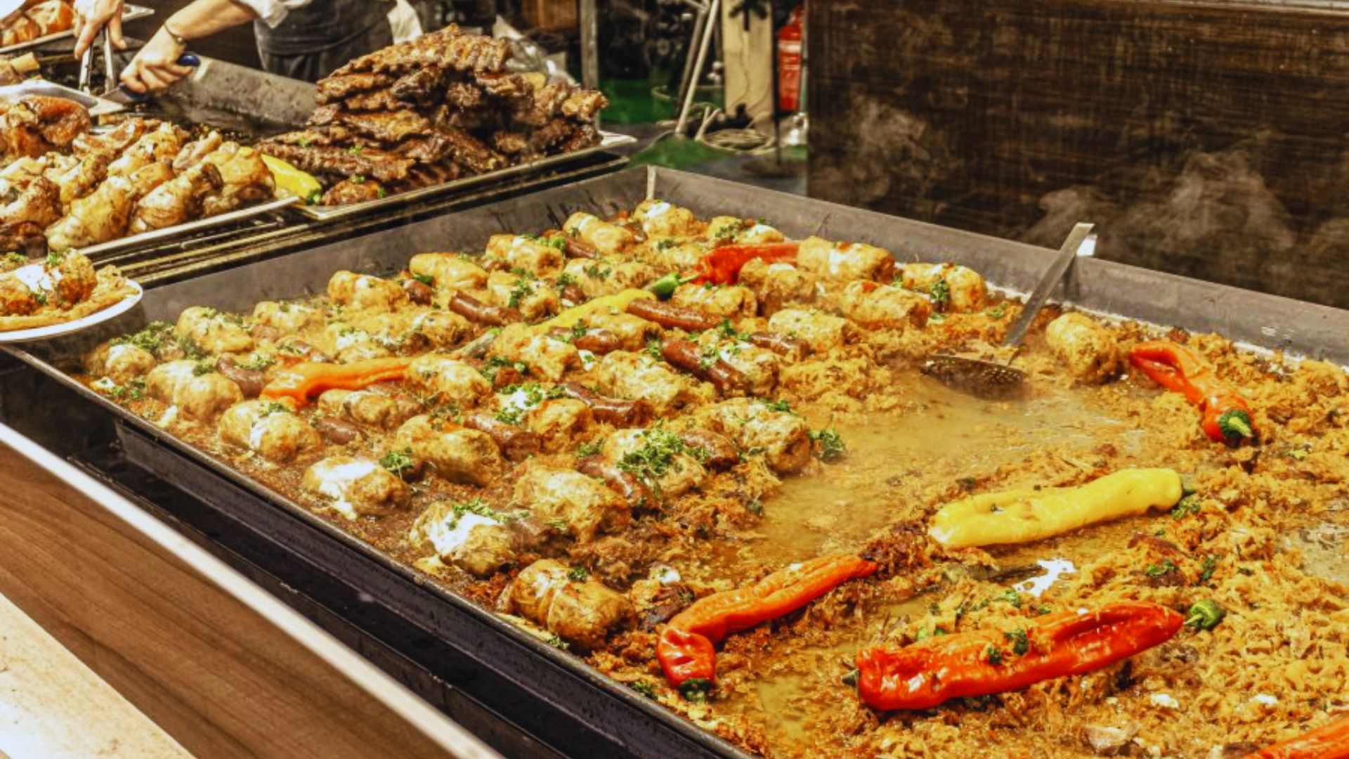 A large buffet featuring a variety of dishes, including salads, meats, and desserts, arranged attractively on tables.