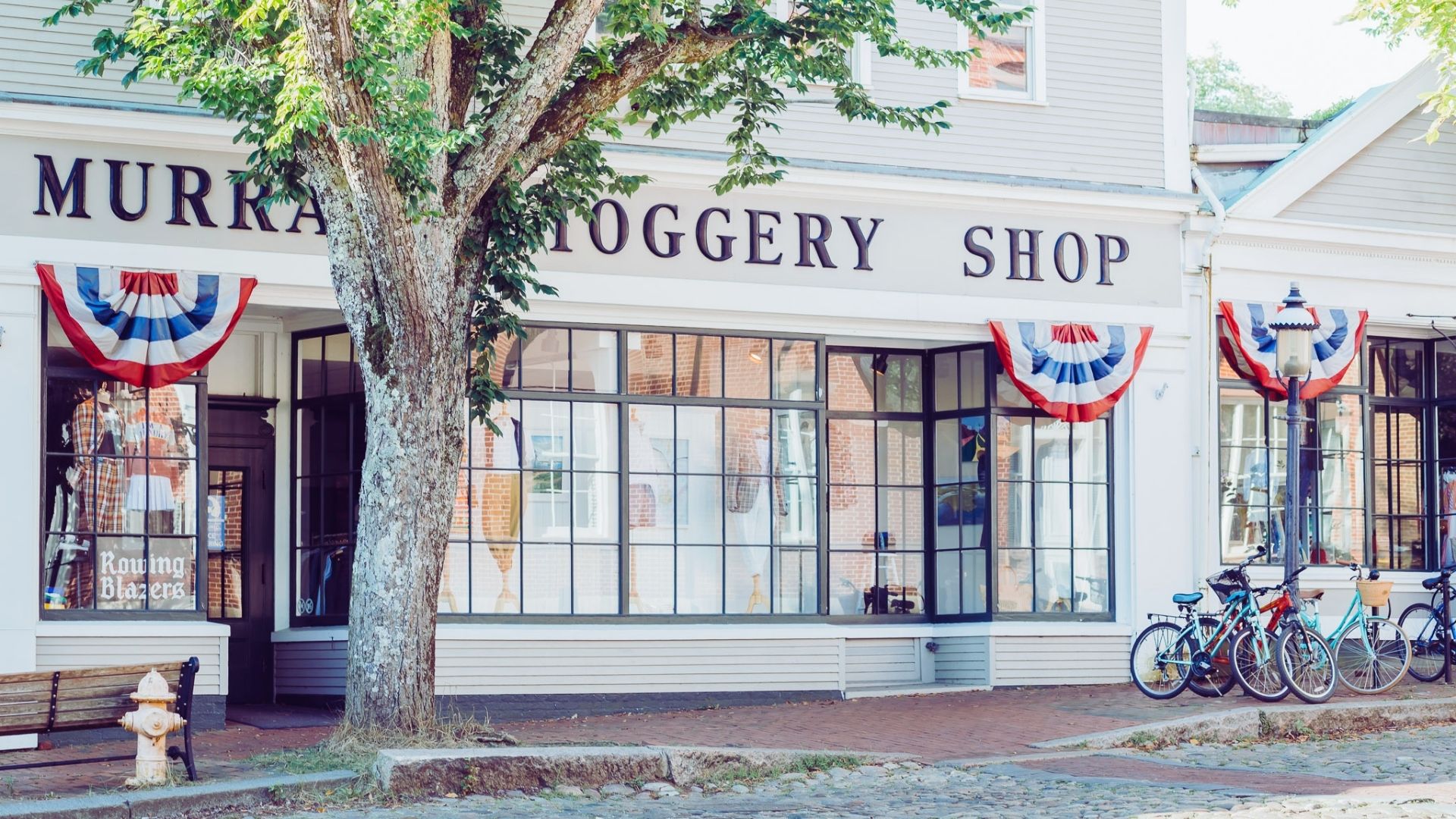 Murray's grocery shop in Maine, featuring a quaint storefront with colorful signage and local produce displayed outside.