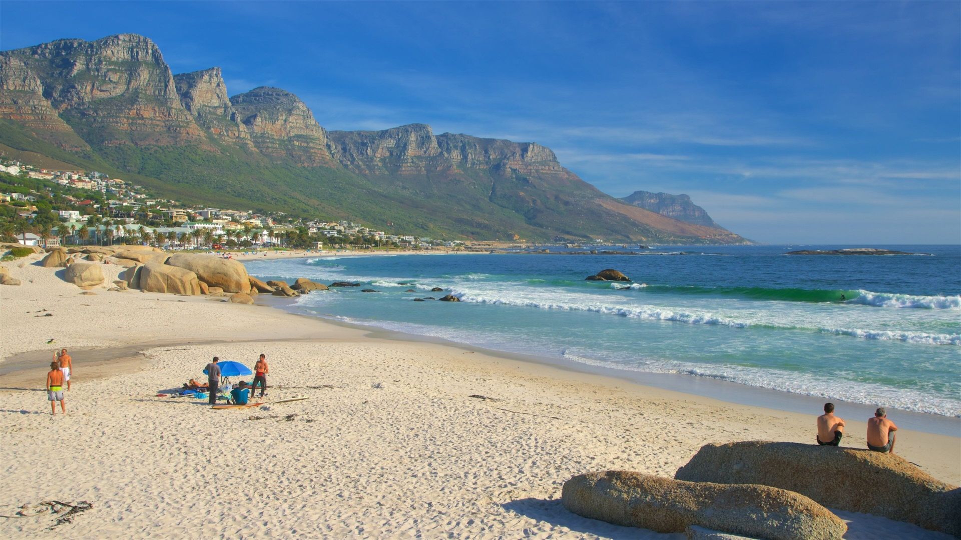A clear blue sky dotted with fluffy white clouds, creating a serene and peaceful atmosphere.