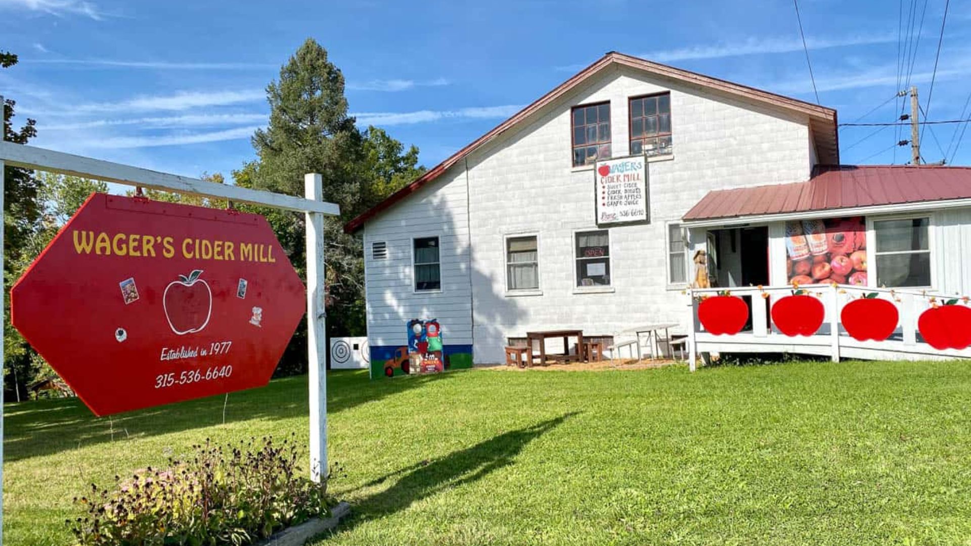 A sign for Wagner's Apple Orchard, indicating a farm store specializing in apples and related products.