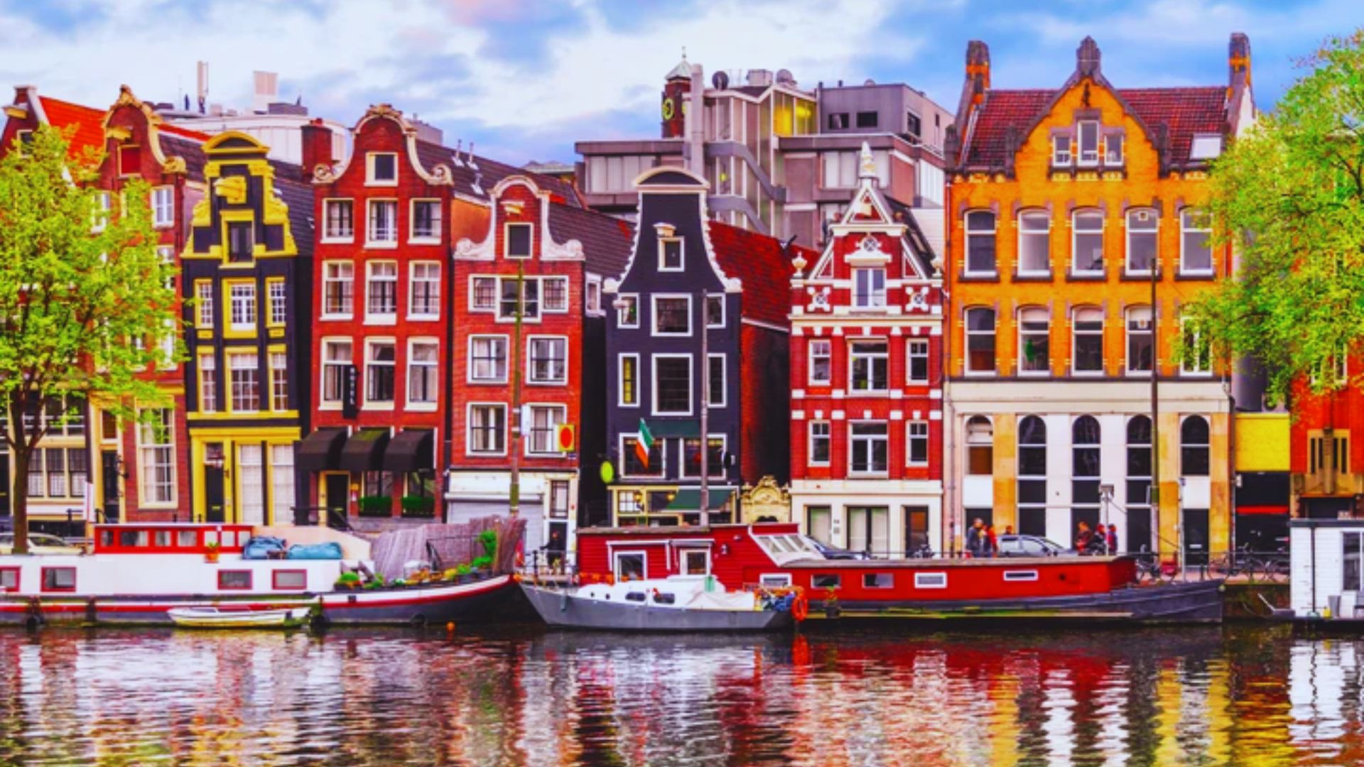 Scenic view of Amsterdam, showcasing iconic canals and architecture, representing the heart of the European Union.