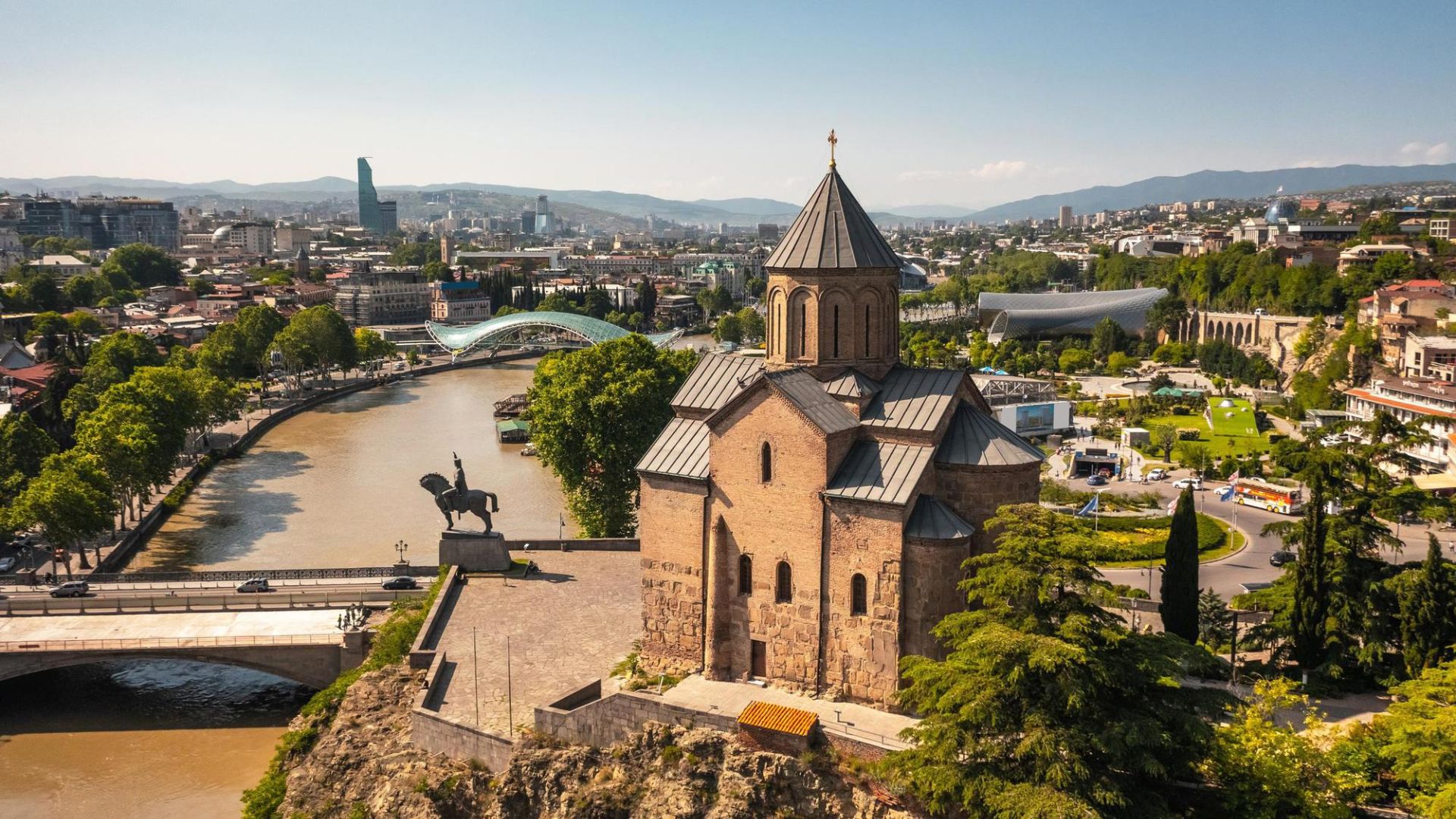 Tbilisi, the capital of Georgia, showcases its stunning architecture and rich historical heritage in a vibrant cityscape.