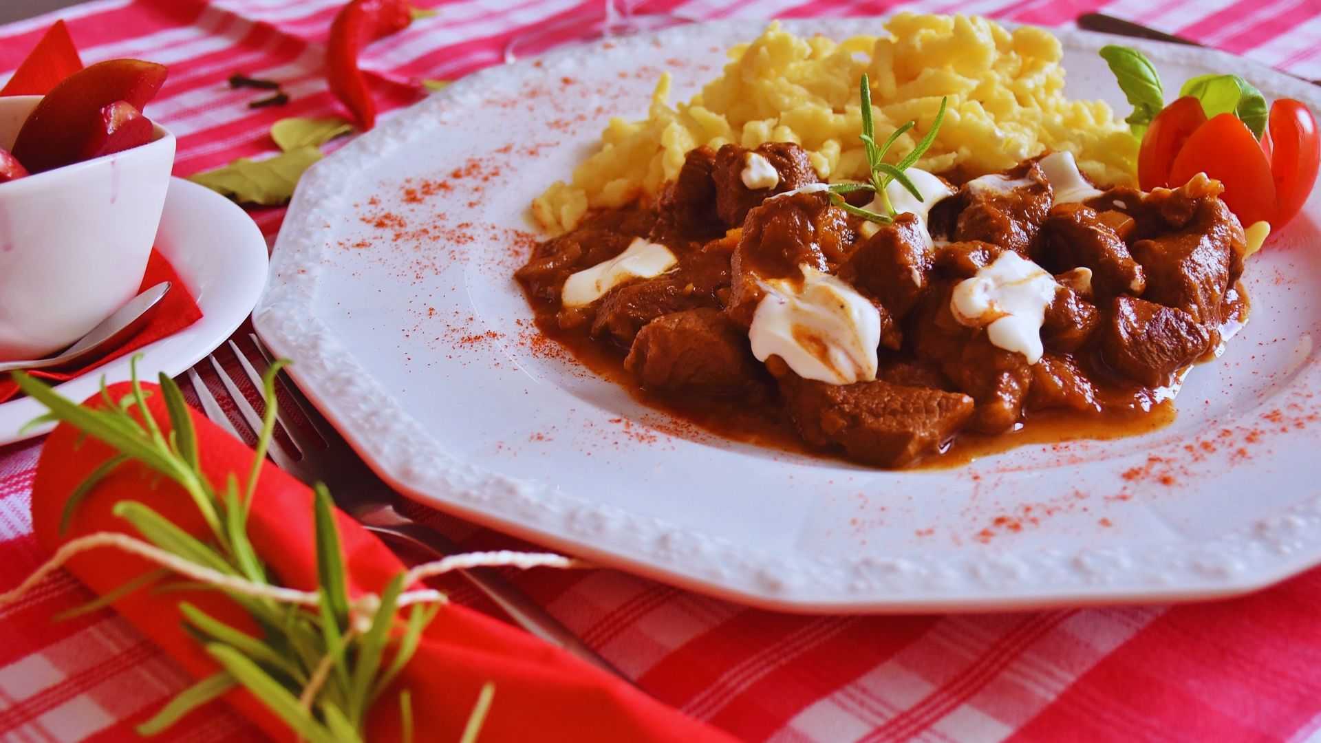 A plate featuring a serving of meat alongside a colorful assortment of vegetables.