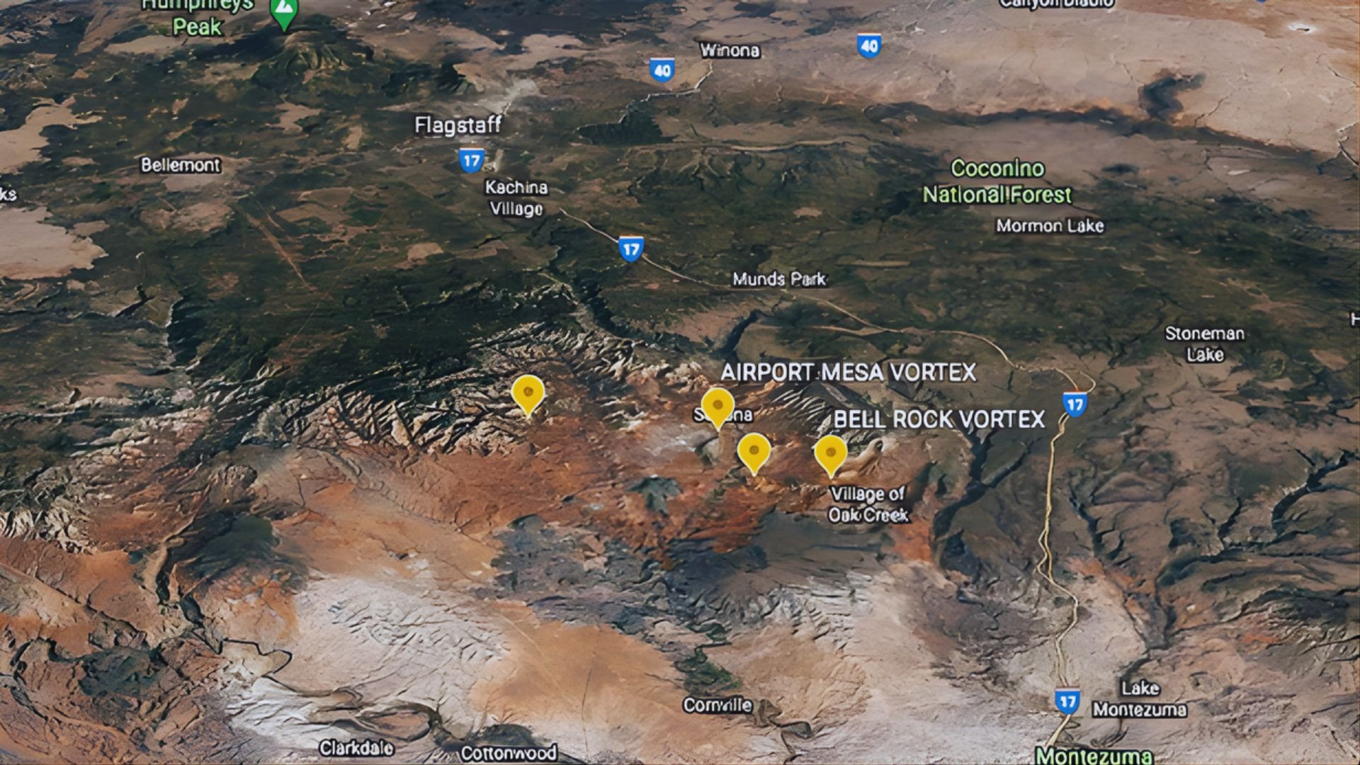 Satellite map of northern Arizona highlighting the Sedona area with marked vortex sites, including Airport Mesa and Bell Rock. Rugged terrain and vivid earth tones.