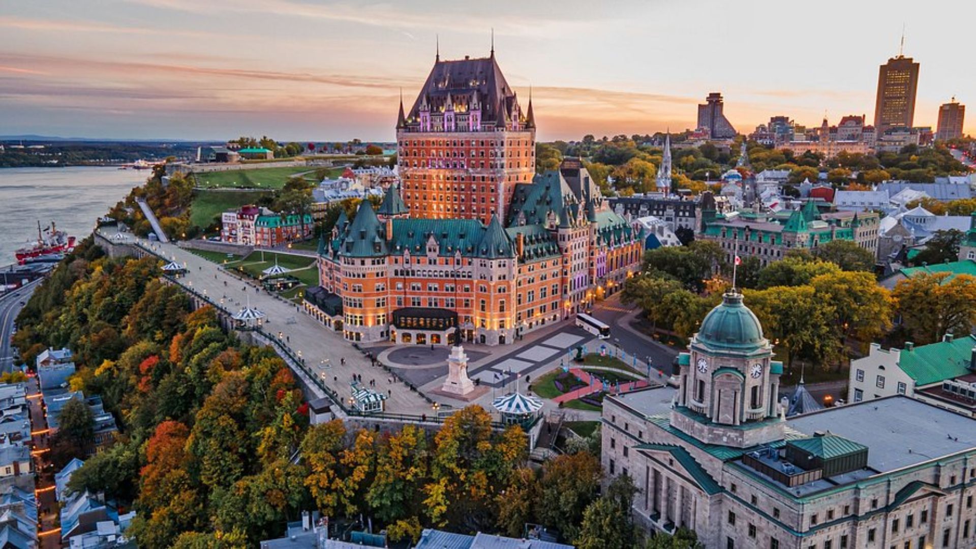 The skyline of Quebec City is visible in the background, showcasing its historic architecture and vibrant urban landscape.