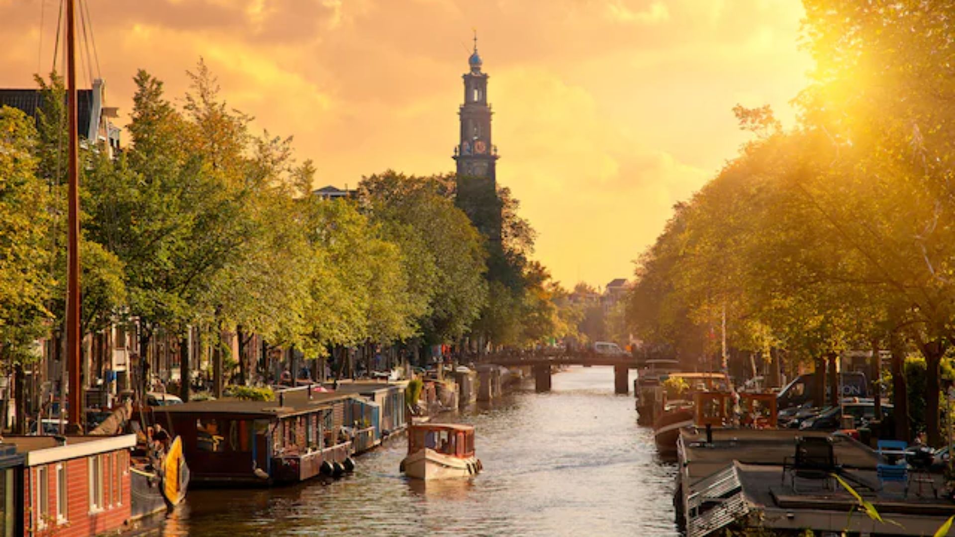 A scenic view of Amsterdam, showcasing its iconic canals and architecture, representing the European Union.