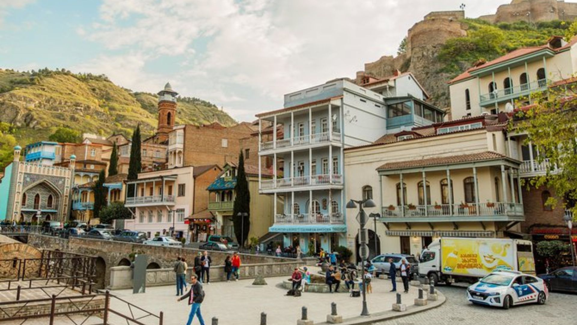 A panoramic view of Tbilisi, showcasing its diverse architecture and the scenic landscape of Georgia.