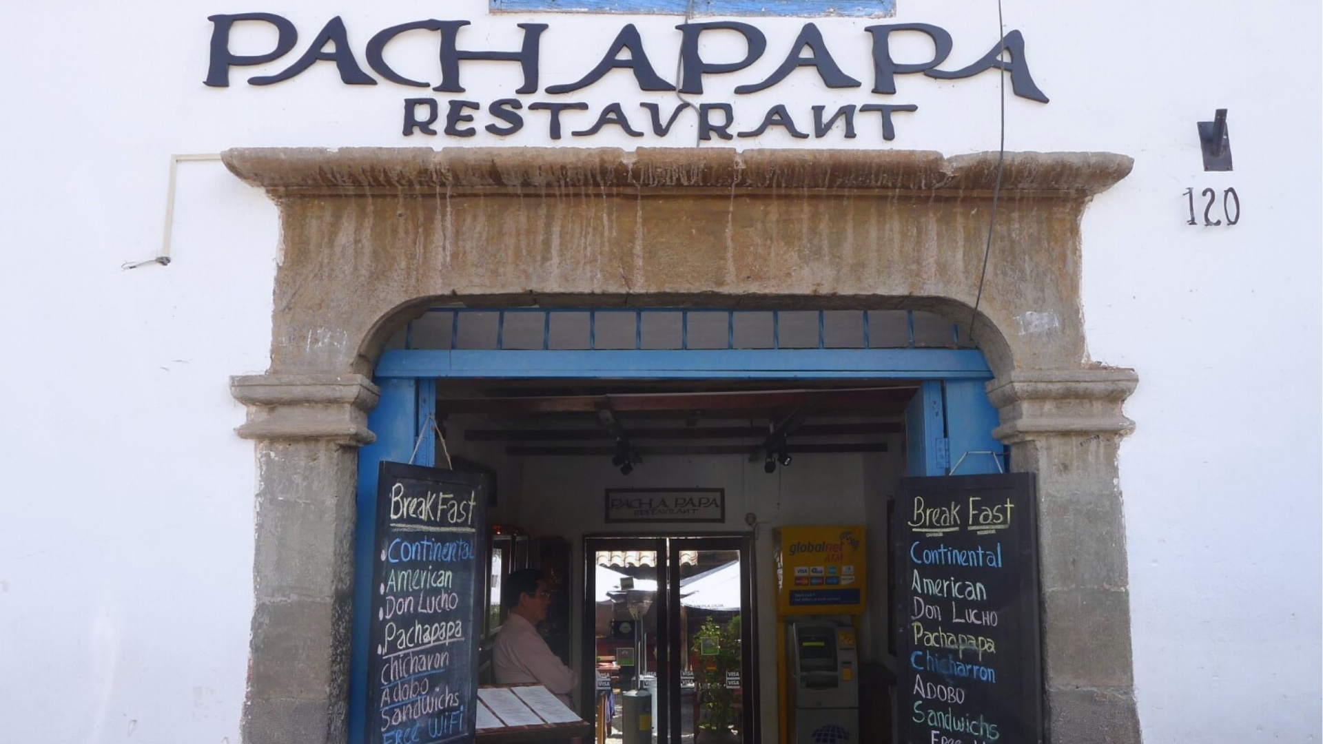 Exterior view of Pachapapa restaurant in San Pedro de Atacama, showcasing its rustic architecture and outdoor seating area.