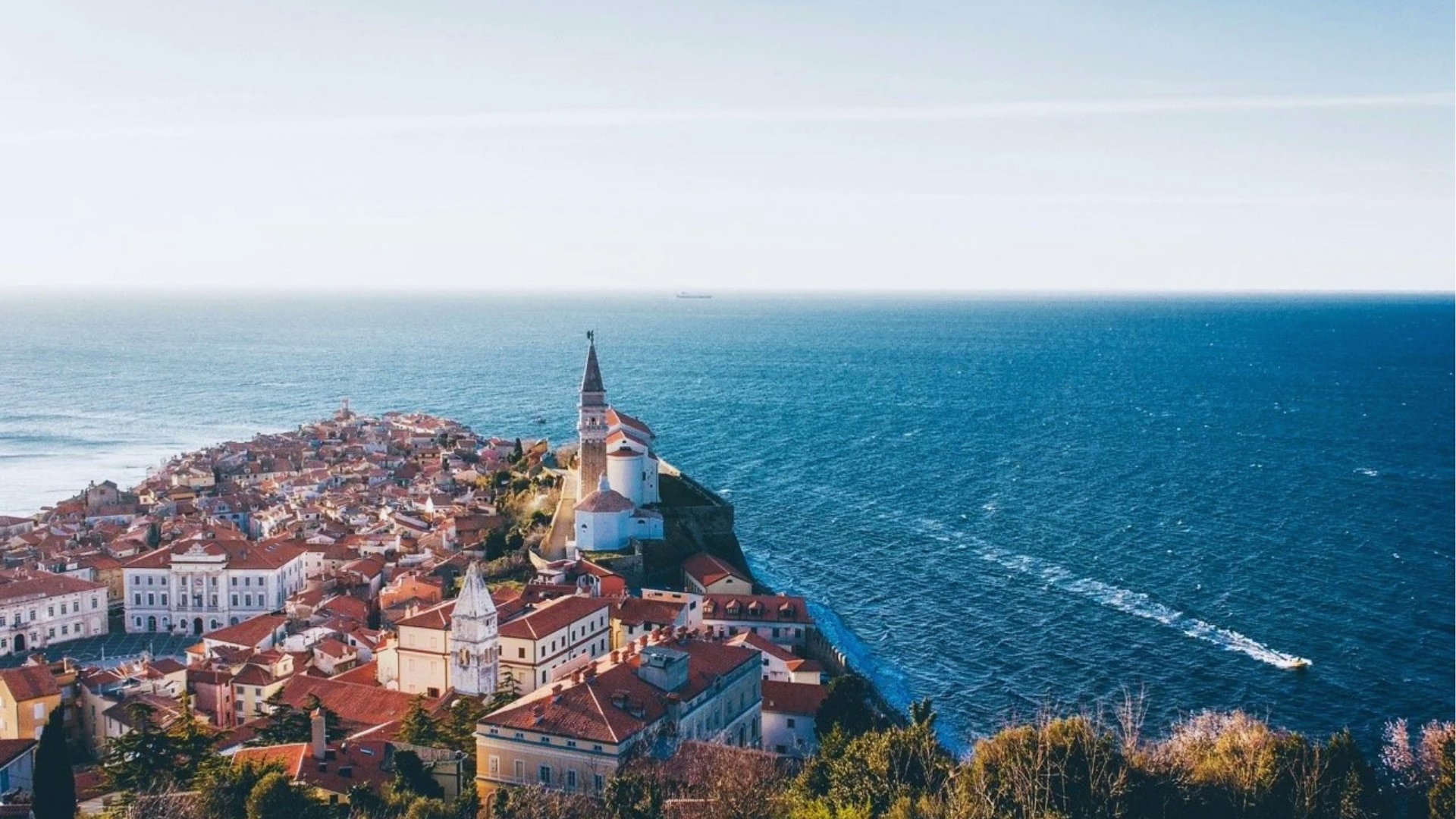 A panoramic view of Split, Croatia, showcasing its historic architecture and the Adriatic Sea in the background.