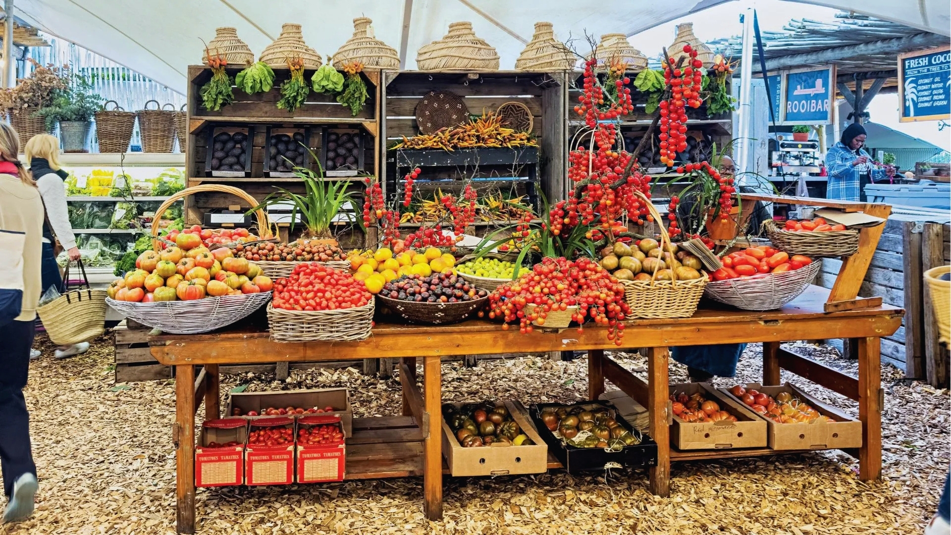 A vibrant market stall filled with a variety of fresh fruits and vegetables on display.