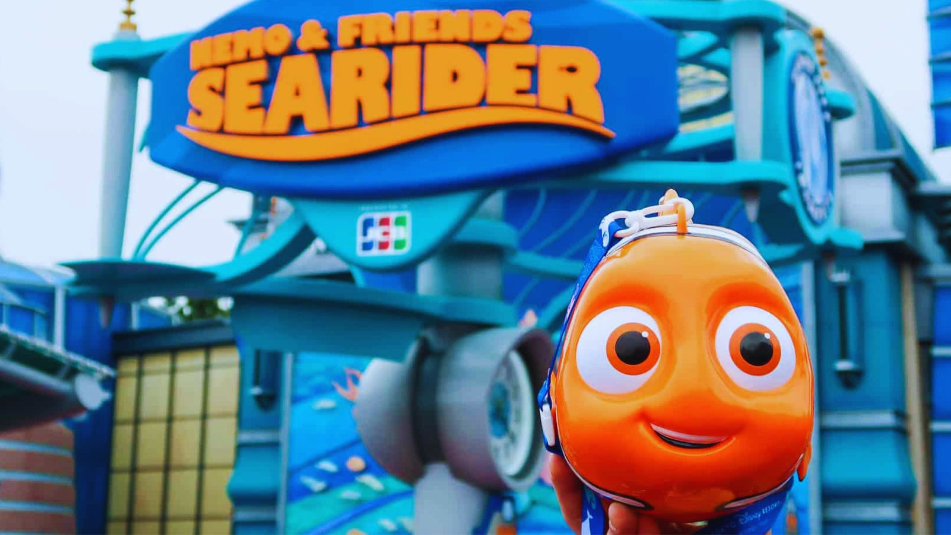 A colorful underwater scene from "Finding Nemo: The Ride," featuring animated characters and vibrant marine life.
