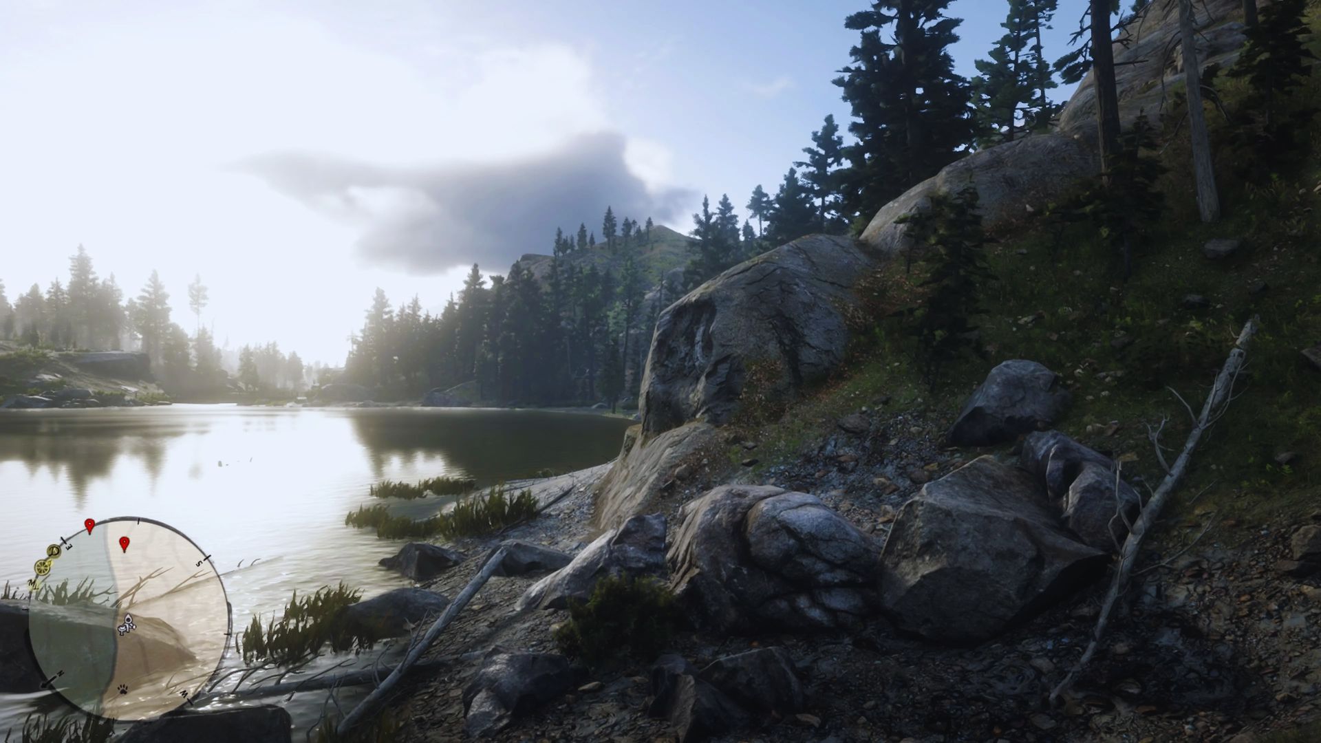 A serene lake surrounded by rocks and trees, reflecting the natural beauty of the landscape.