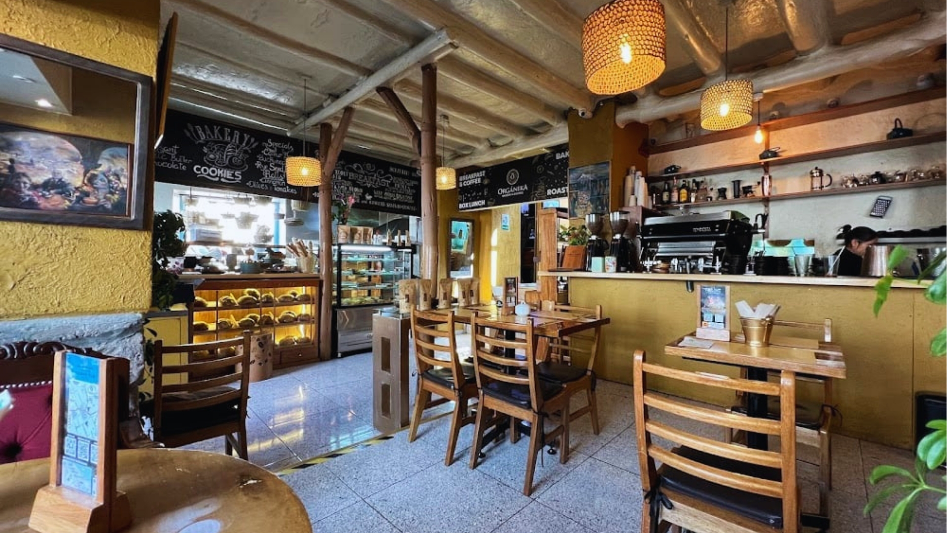 A restaurant interior featuring neatly arranged tables and chairs for dining.