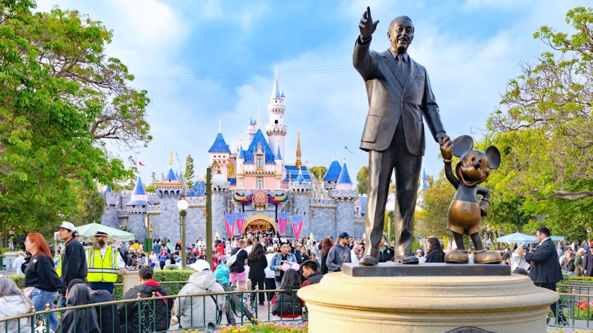 A vibrant view of Disneyland, showcasing its iconic attractions and joyful visitors enjoying the magical atmosphere.