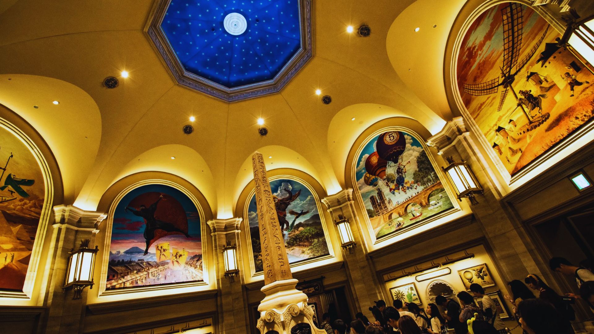 A spacious room featuring a dome ceiling adorned with intricate paintings on the walls.