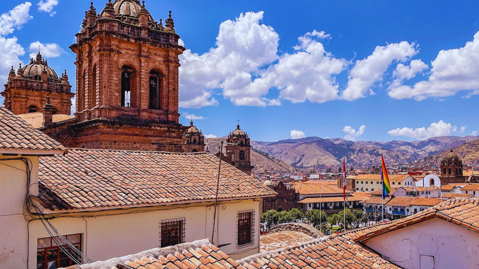 A panoramic view of Cusco, Peru, showcasing its historic architecture and mountainous backdrop.