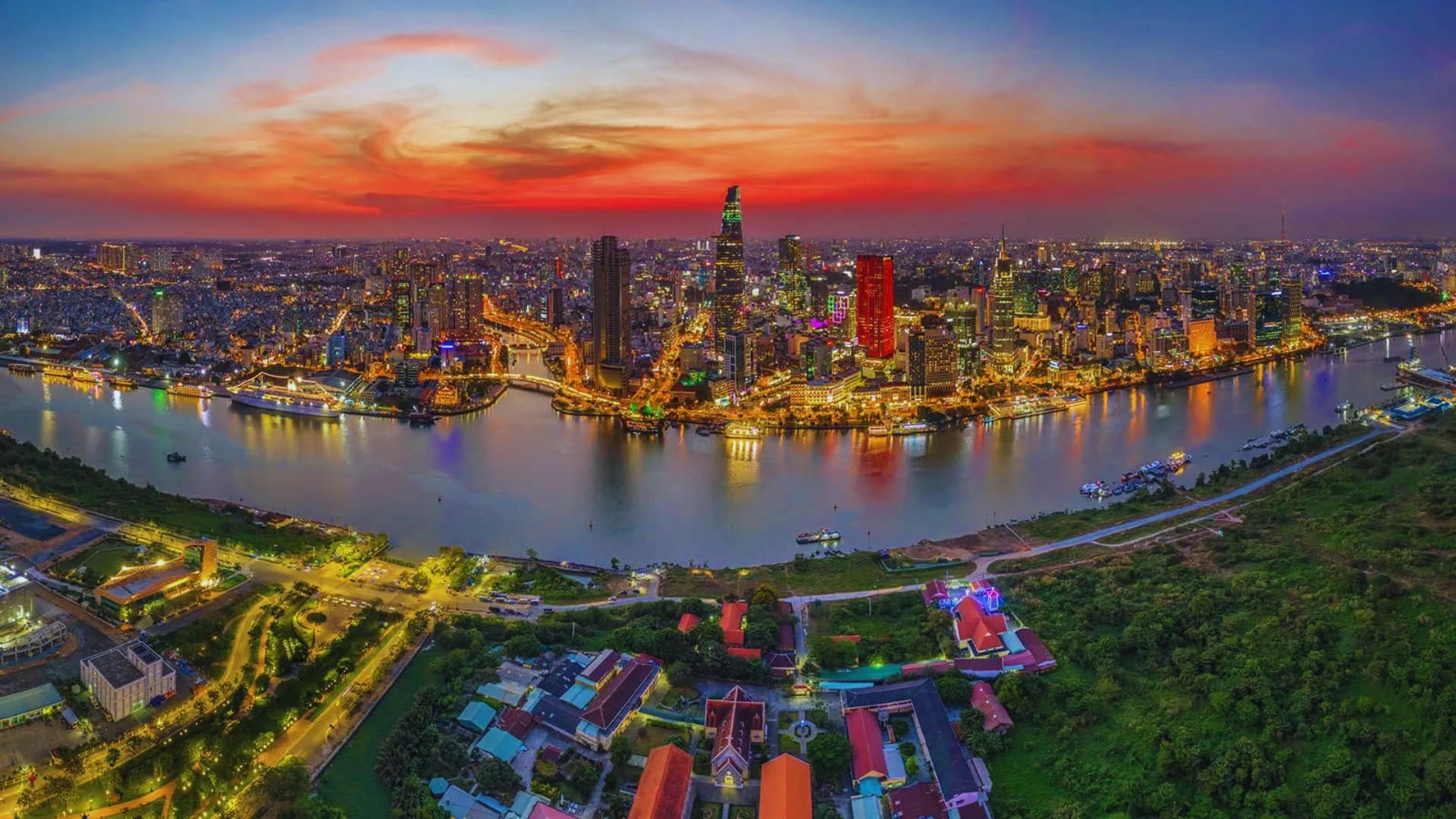 City skyline in China at sunset, showcasing vibrant colors and silhouettes of buildings against the evening sky.