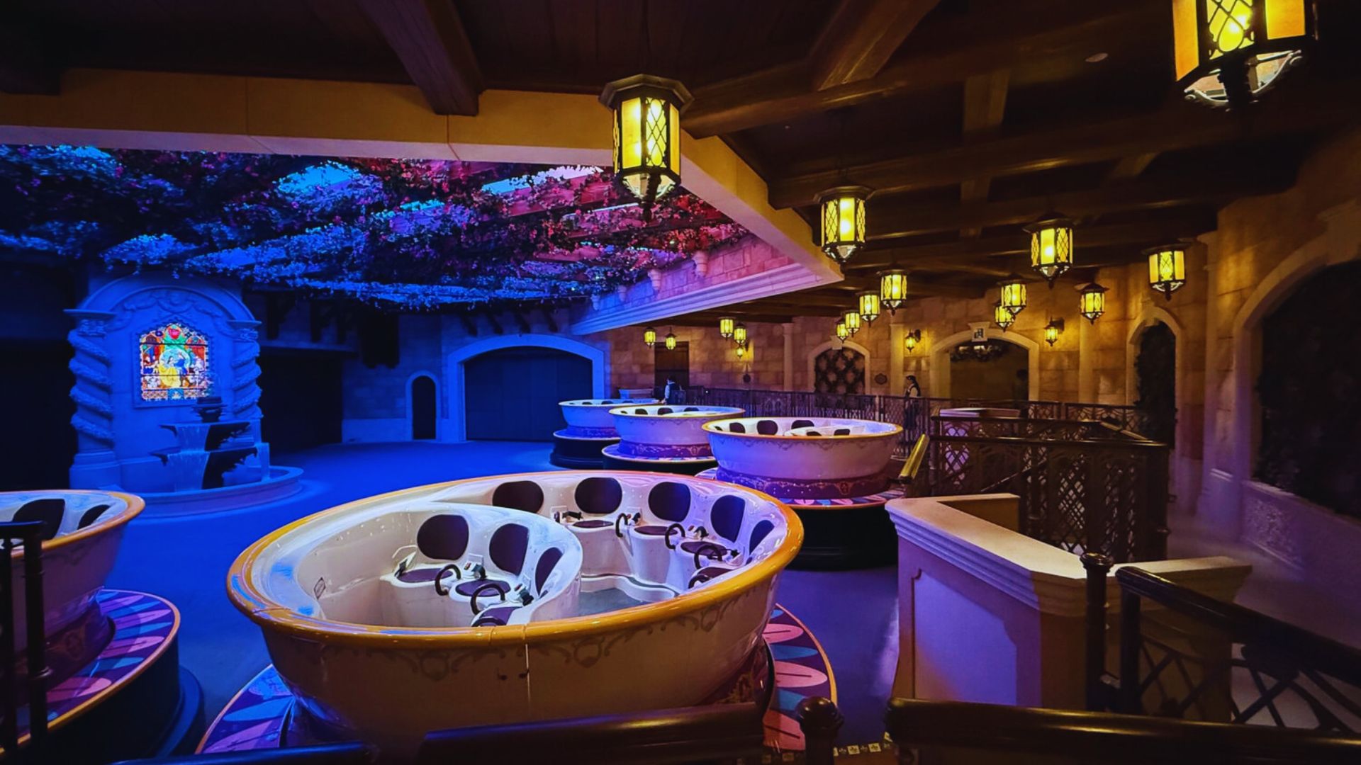 Illuminated tea cups adorned with lights, creating a festive and enchanting atmosphere.