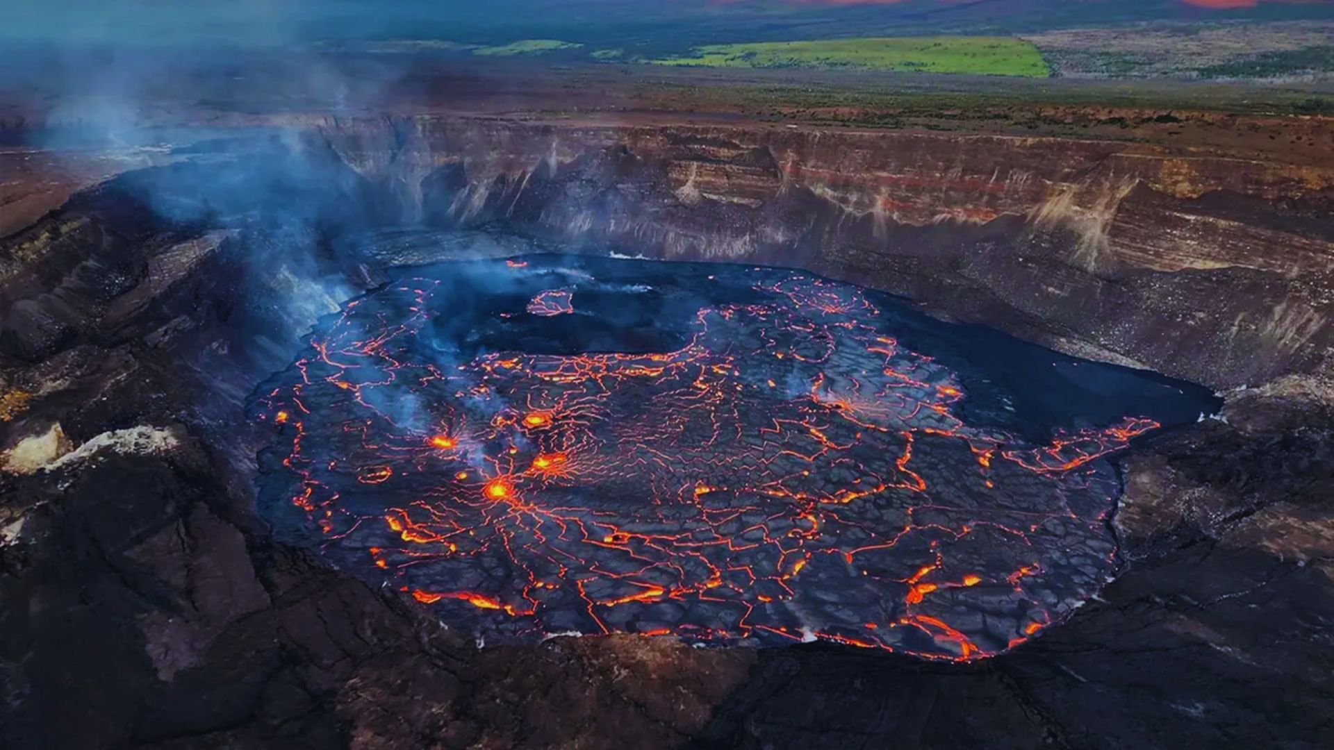 A vibrant lava lake in Hawaii, showcasing molten lava glowing against a dark volcanic landscape.